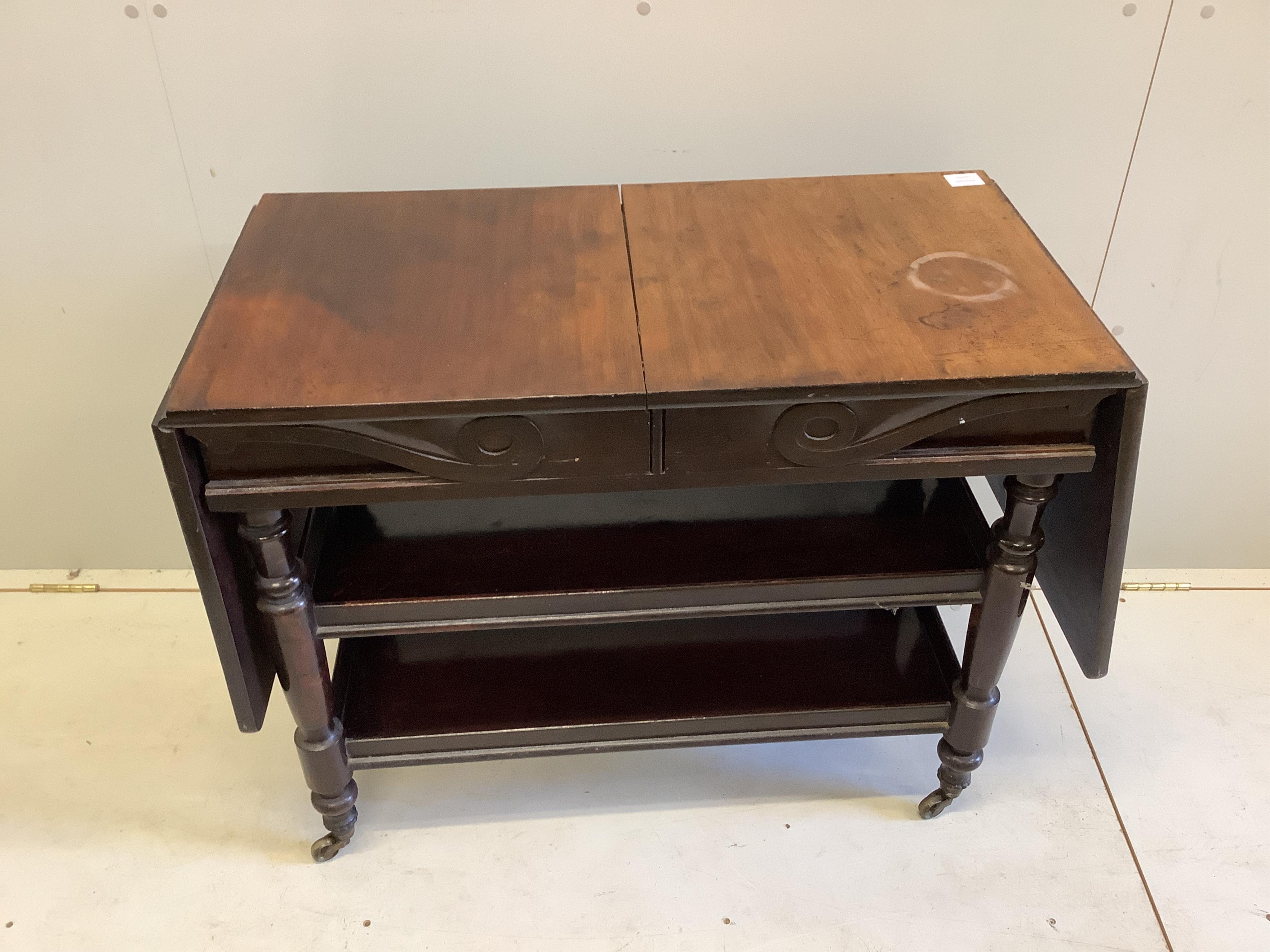 A Victorian mahogany drop flap three tier side table, width 89cm, depth 45cm, height 72cm. Condition - fair
